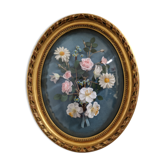 Oval domed glass frame and flower decoration
