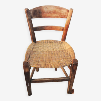 Old woven straw children's chair