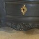 Black and wood chest of drawers
