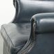 Dark blue cowhide club armchair with a unique and timeless design