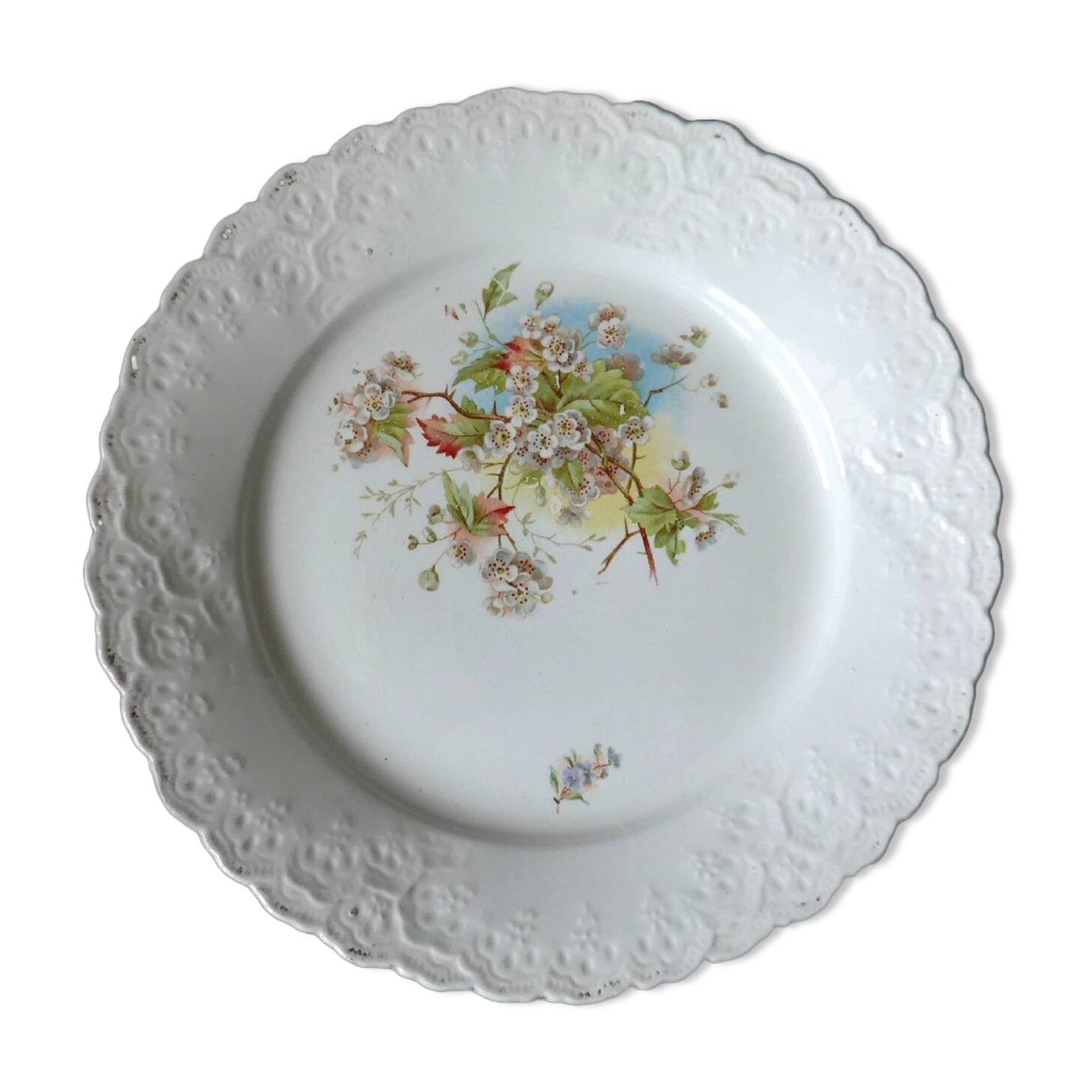 Antique earthenware plate with cherry blossom decoration