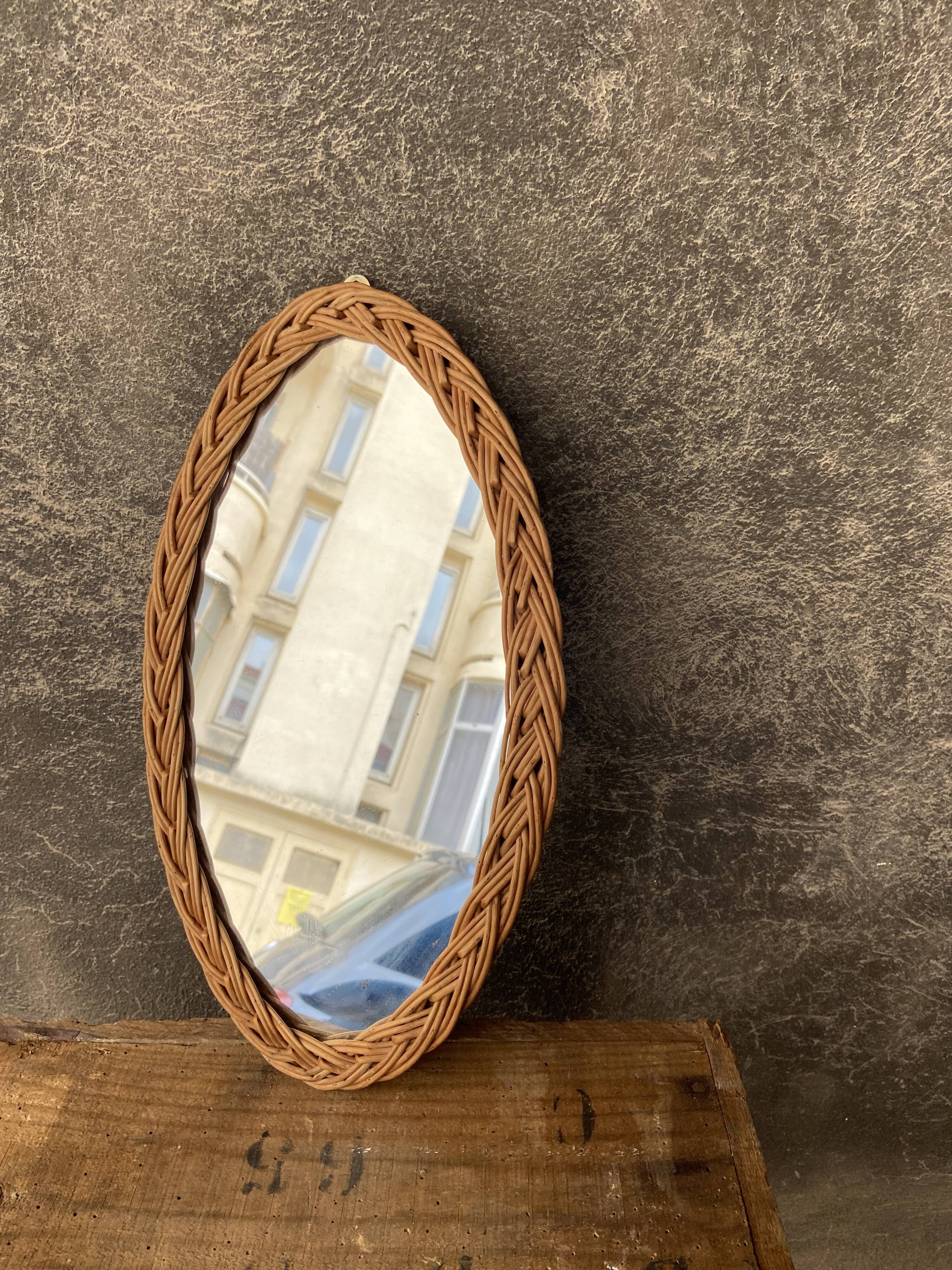 Oval mirror in vintage wicker