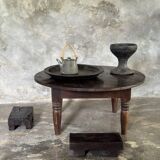 Coffee table, round antique Indonesian teak table with straight legs.