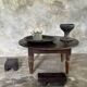 Coffee table, round antique Indonesian teak table with straight legs.
