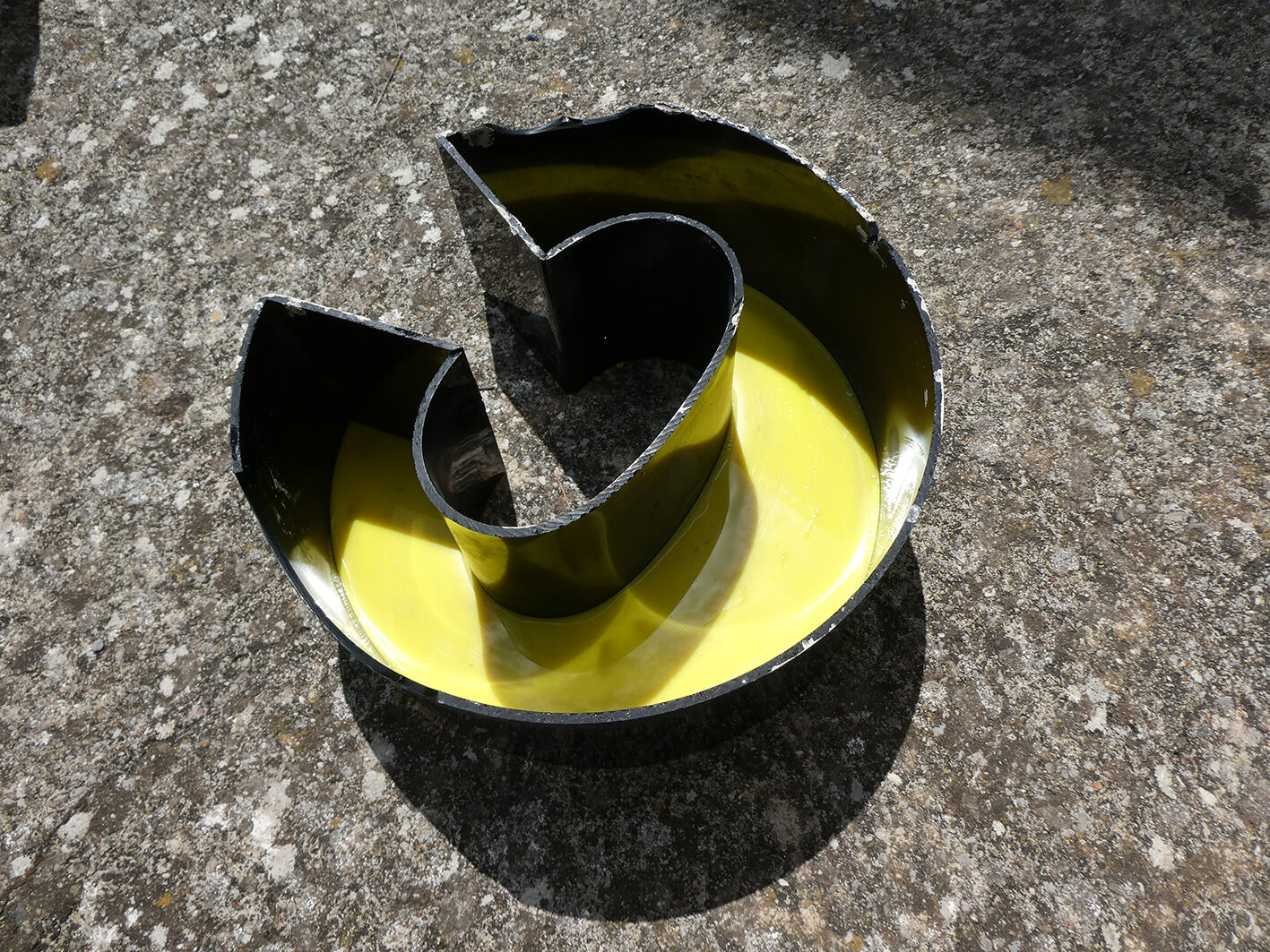 Letter C of yellow and black industrial sign