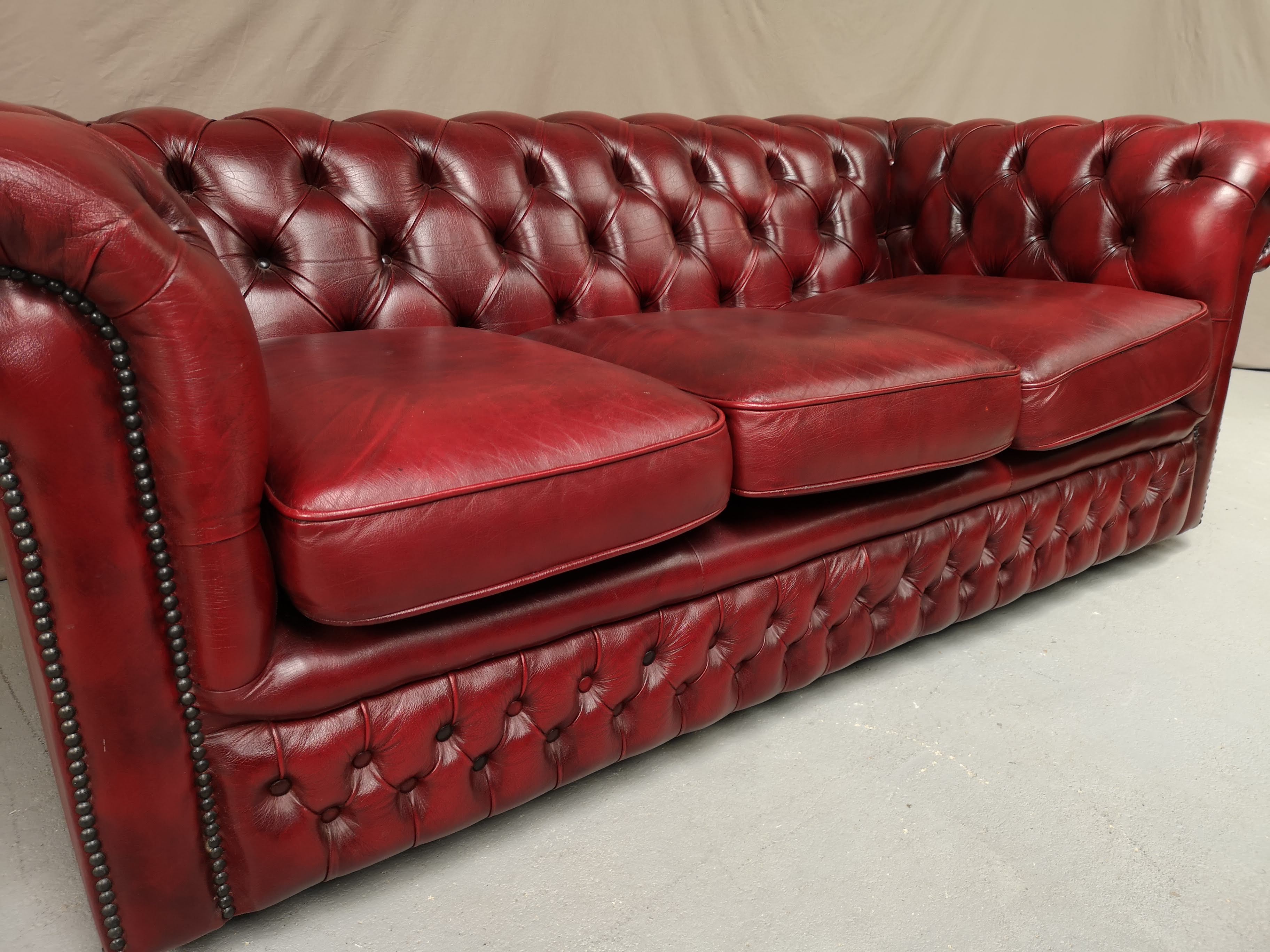 Red leather chesterfield sofa