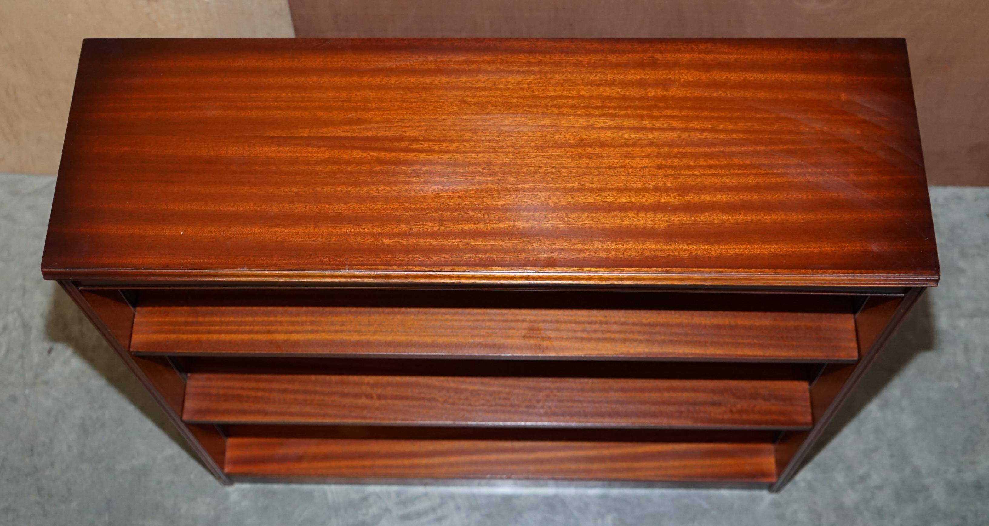 Pair of open dwarf bookshelves in mahogany by Shaws of London.