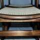 Set of 12 "sledge" dining chairs in walnut and cane.