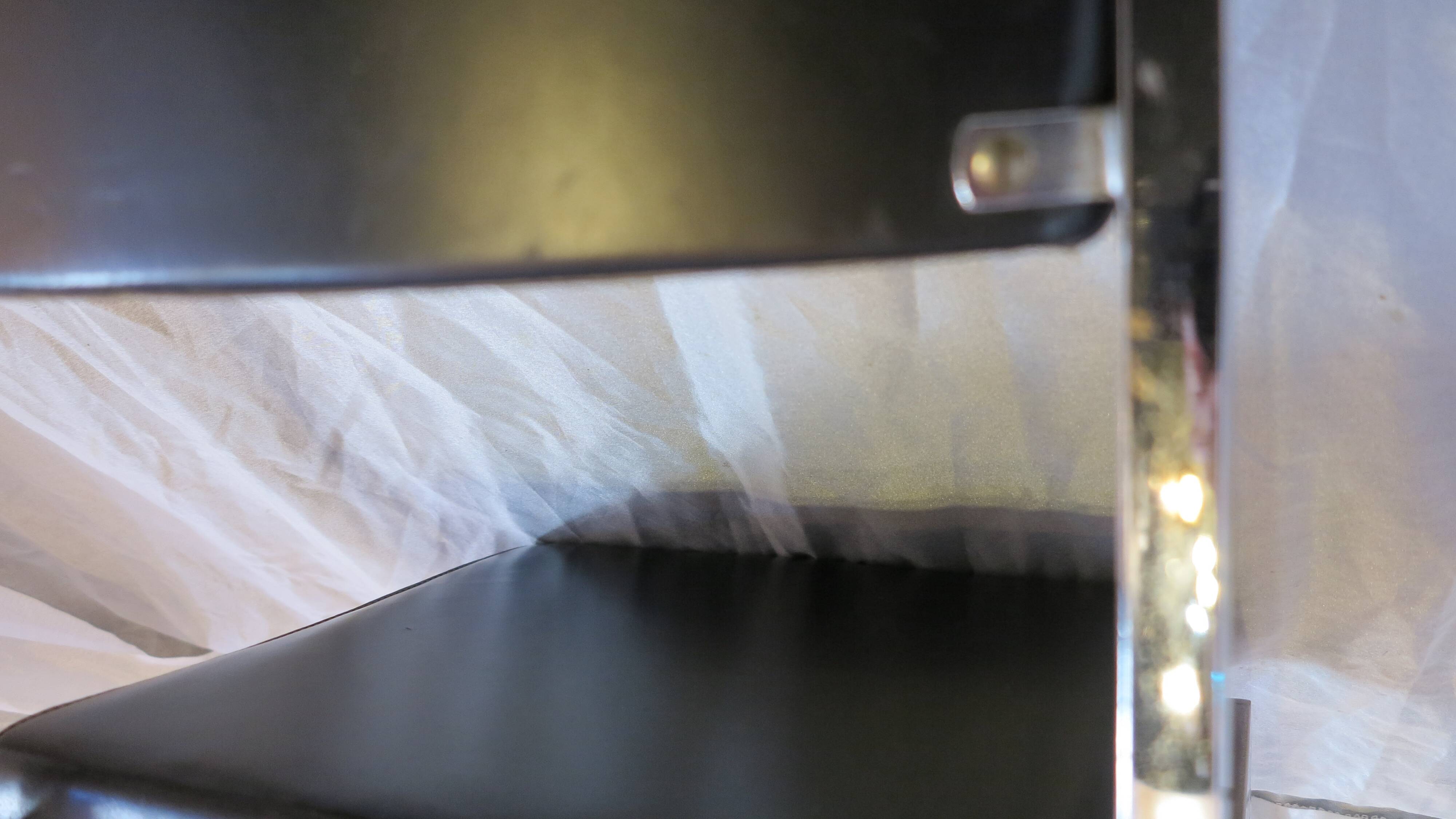 Modernist chair in chromed metal and black imitation leather