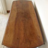 Mid-19th-century walnut round table with shutters, flaps