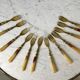 set of 12 horn dessert forks from the 50s