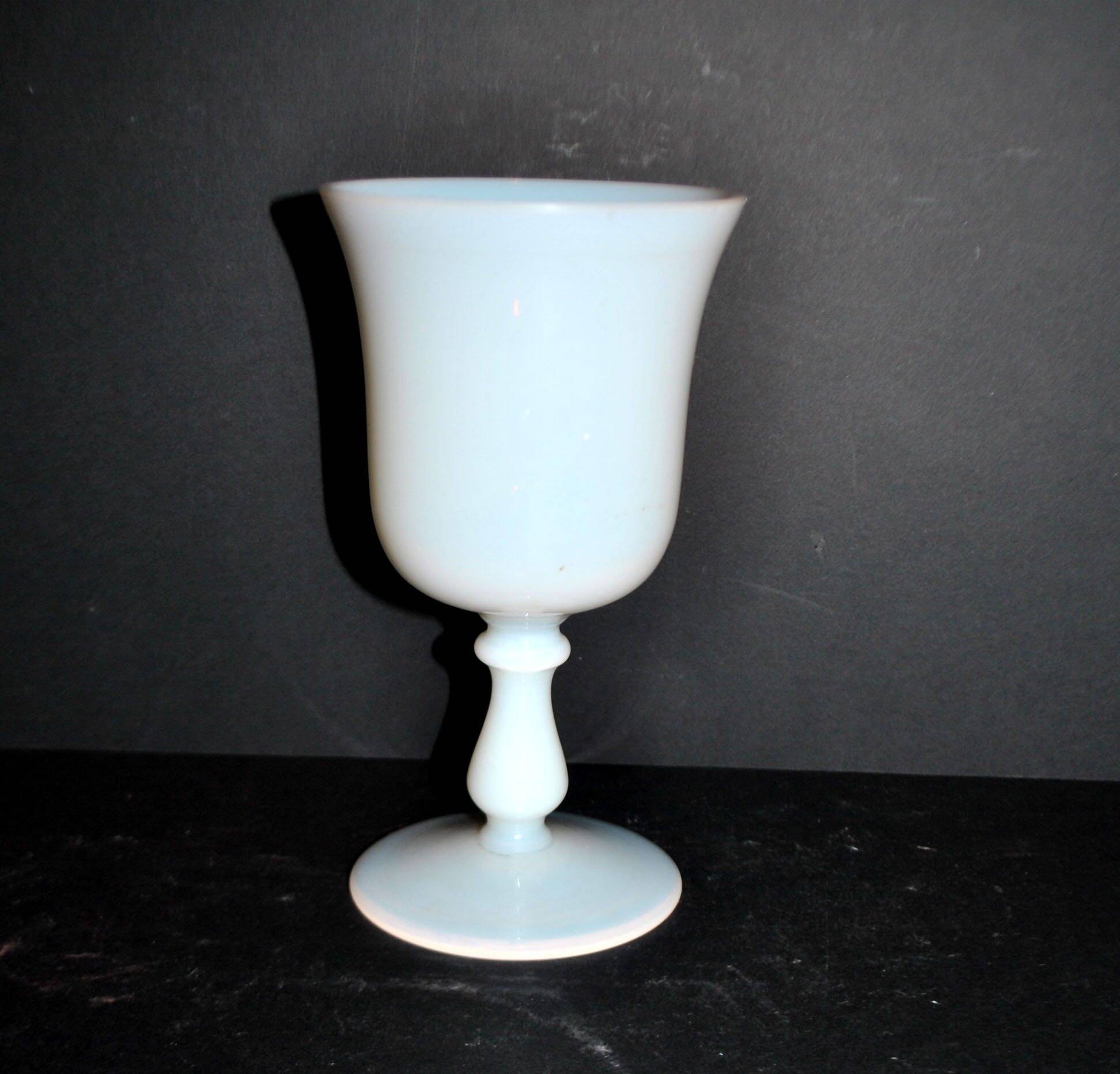 Ancient opaline white glass goblet with a soap bubble effect.