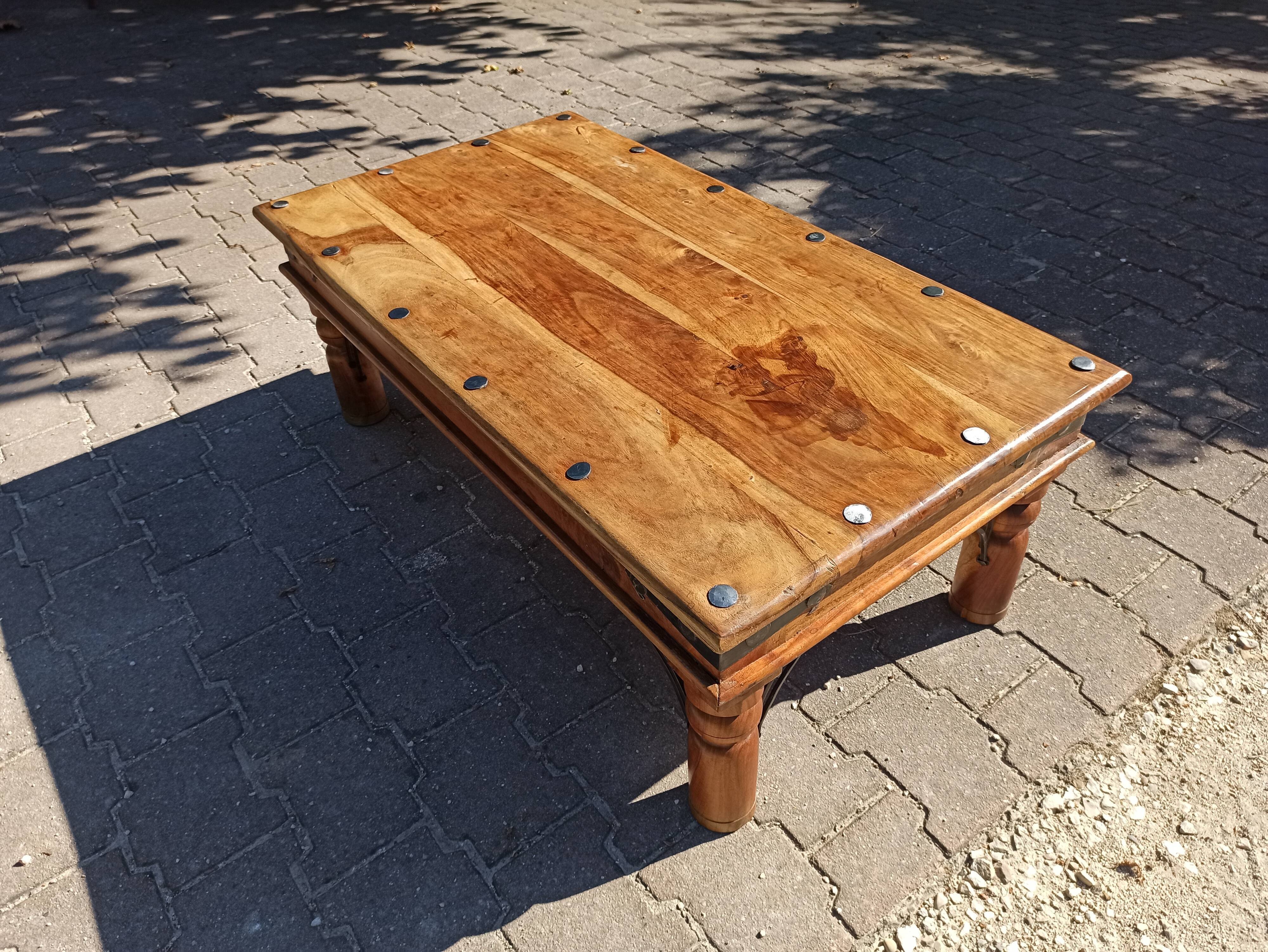 Medieval-inspired red oak coffee table with ironwork