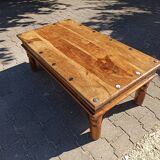 Medieval-inspired red oak coffee table with ironwork