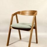 Vintage dining chair in light oak with natural linen pastel green fabric.