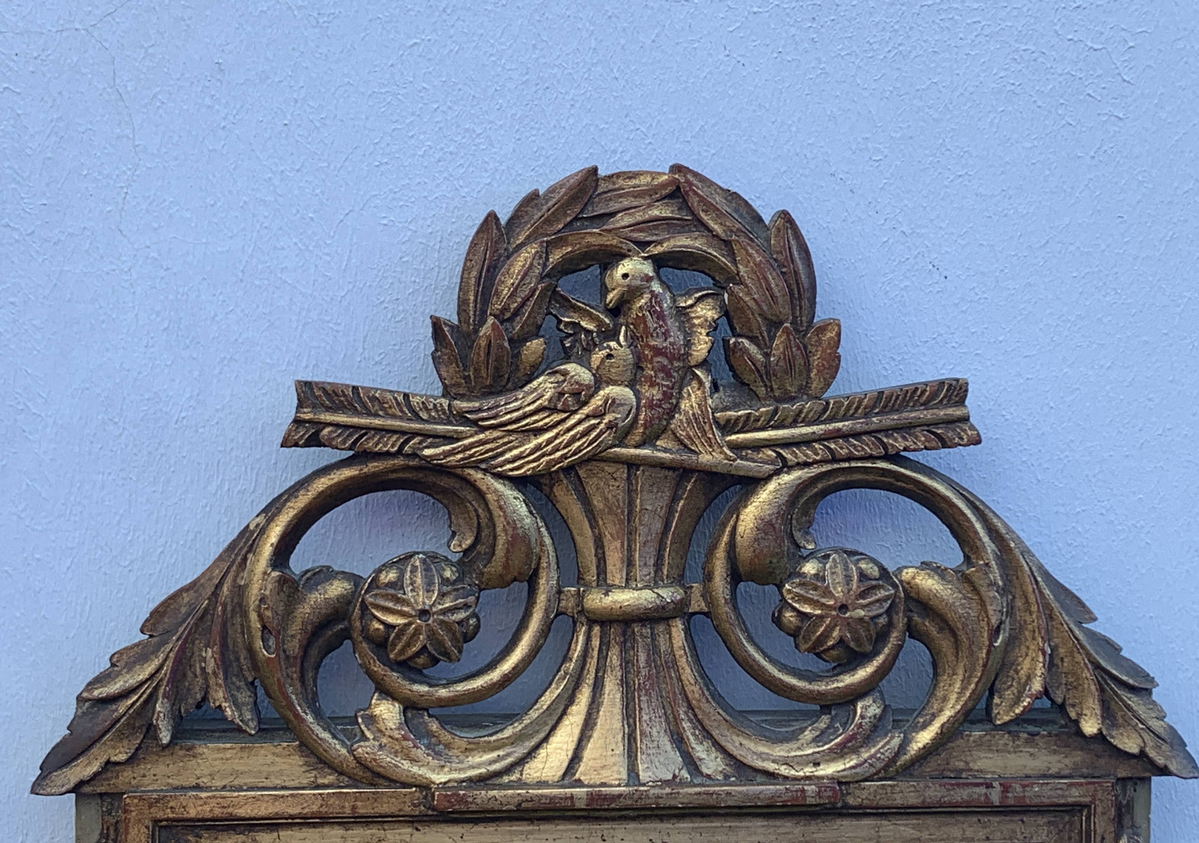 Antique mirror with gilded wood pediment, Louis XVI style