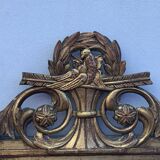 Antique mirror with gilded wood pediment, Louis XVI style