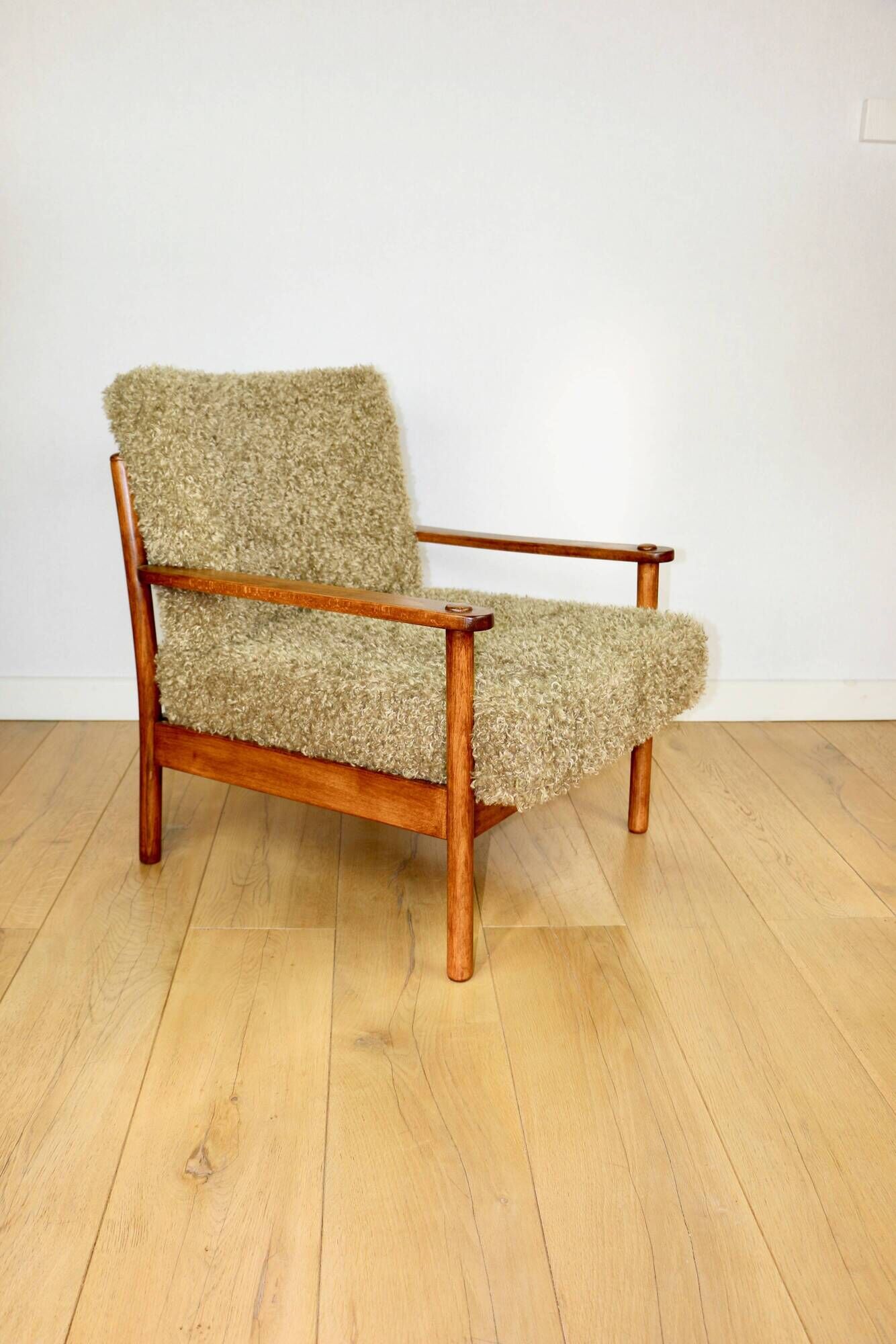 Wooden vintage brown armchair, olive green, long pile on removable cushions