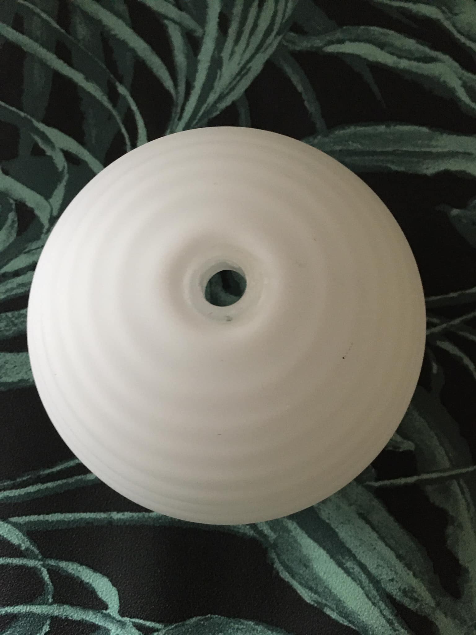 Spherical globe in white opal striated patterns