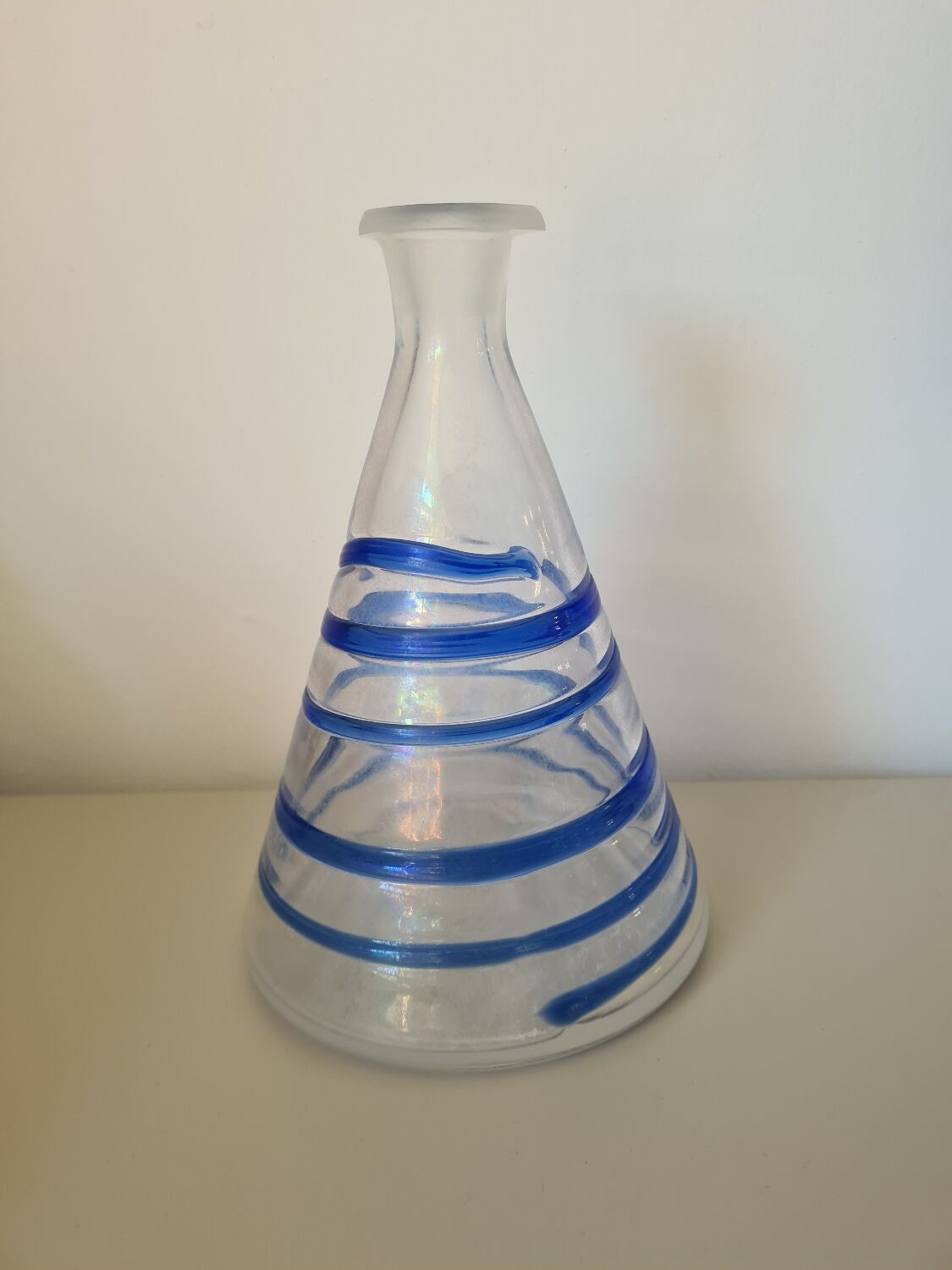 Conical glass vase/carafe blown with a blue spiral decoration.