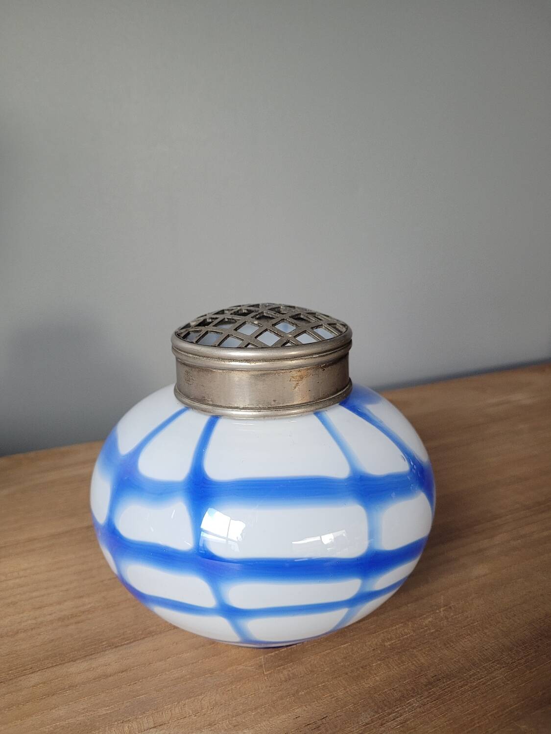 Old white and blue glass flower vase