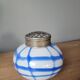 Old white and blue glass flower vase