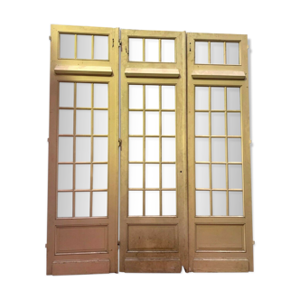 Suite of three separation doors in patinated fir XX century