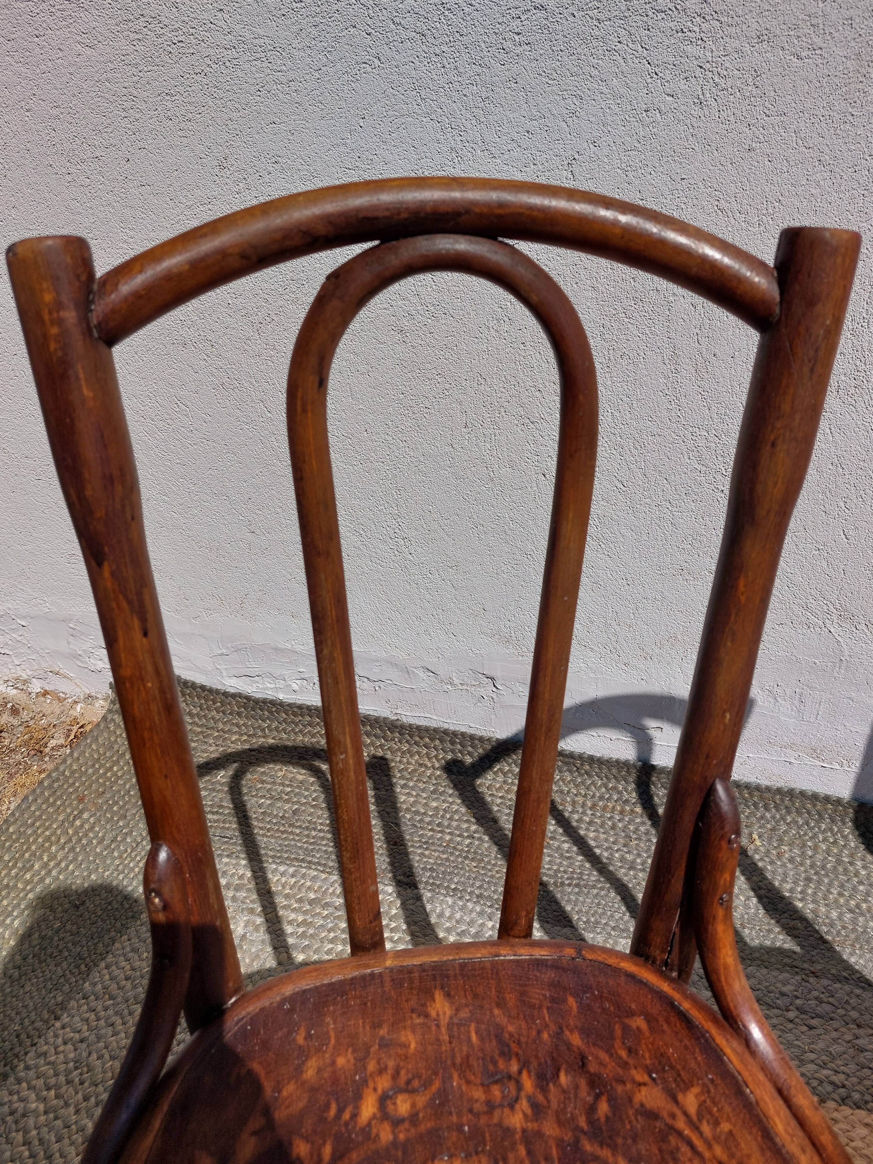 set of 3 curved wooden bistro chairs with patterns