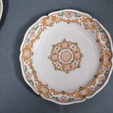 Two 18th century earthenware plates with grand feu decoration in ochre, green and manganese