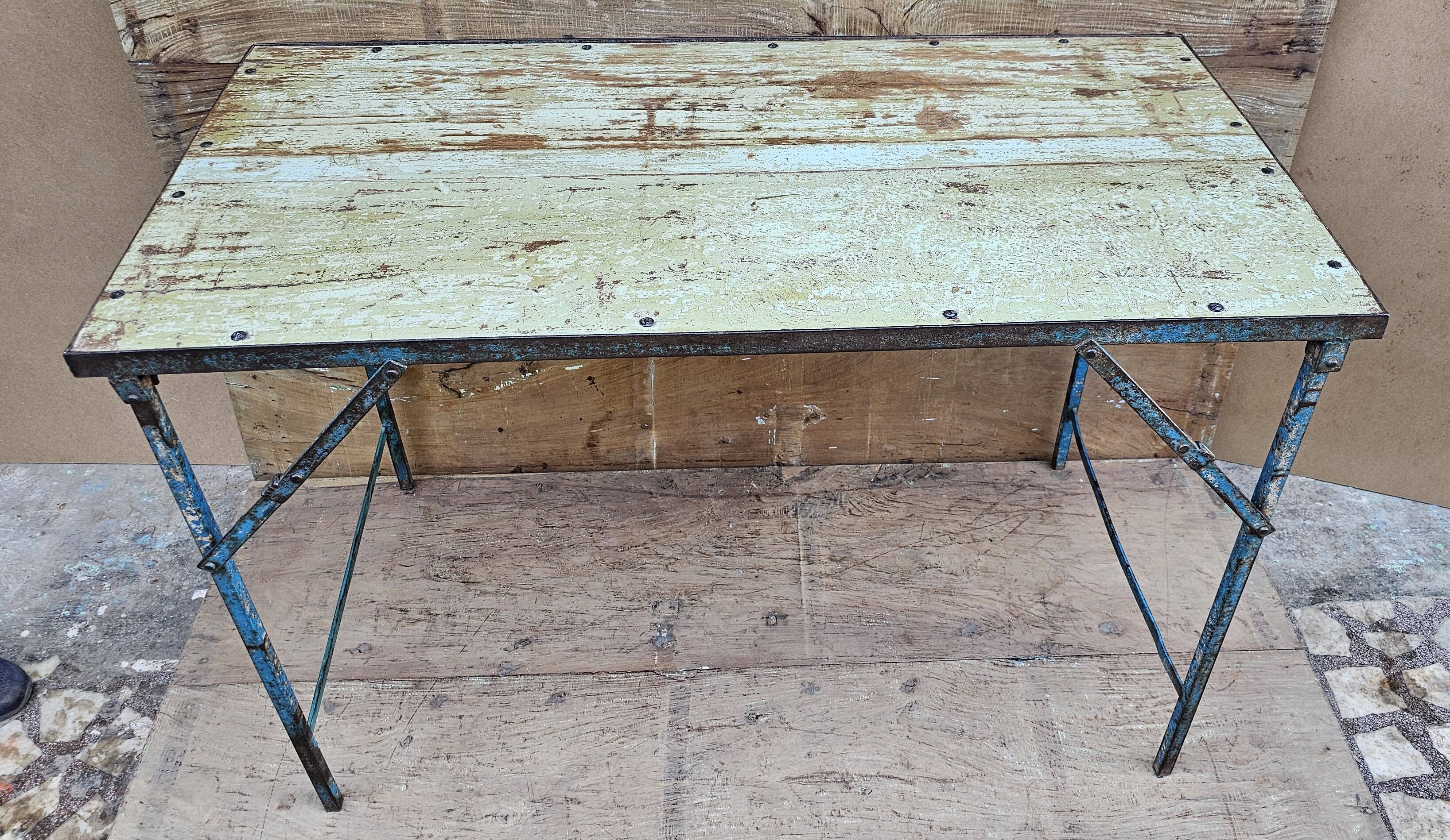 Old folding table in Burmese teak and steel