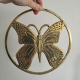 Brass trivet depicting a butterfly