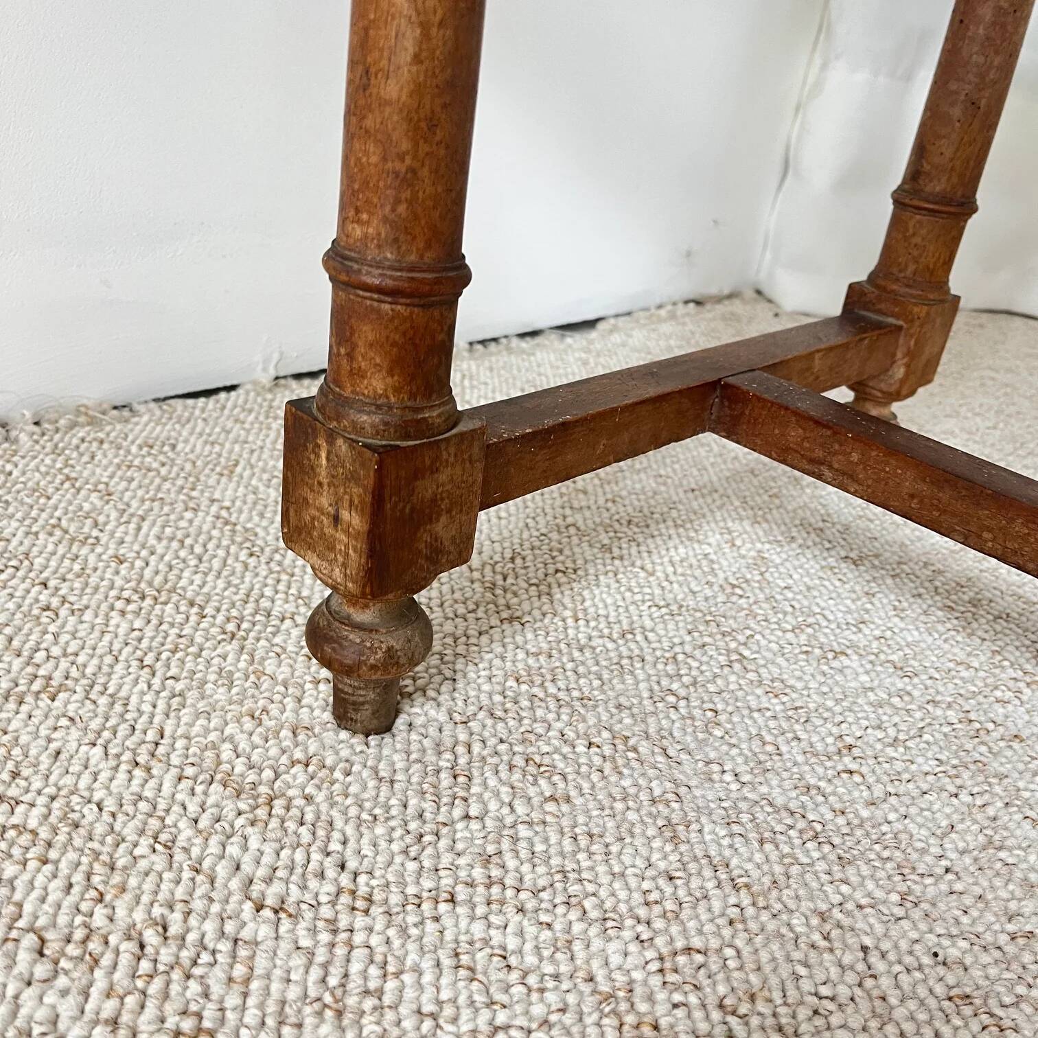 Antique banquette in Louis XIII style, turned wood with caning, late 19th to early 20th century.