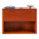 Vintage teak bar cabinet with black glass interior.