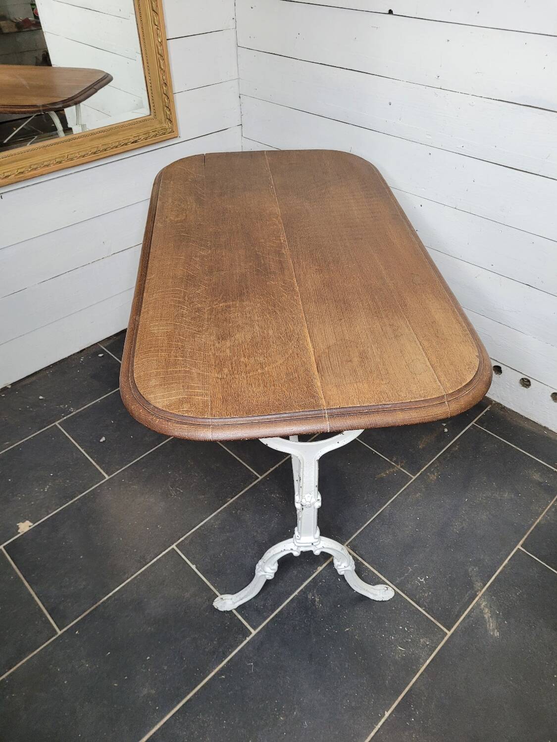 Bistro table with cast iron base and oak top