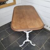 Bistro table with cast iron base and oak top