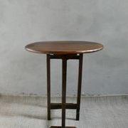 Small table known as a winemaker's table.