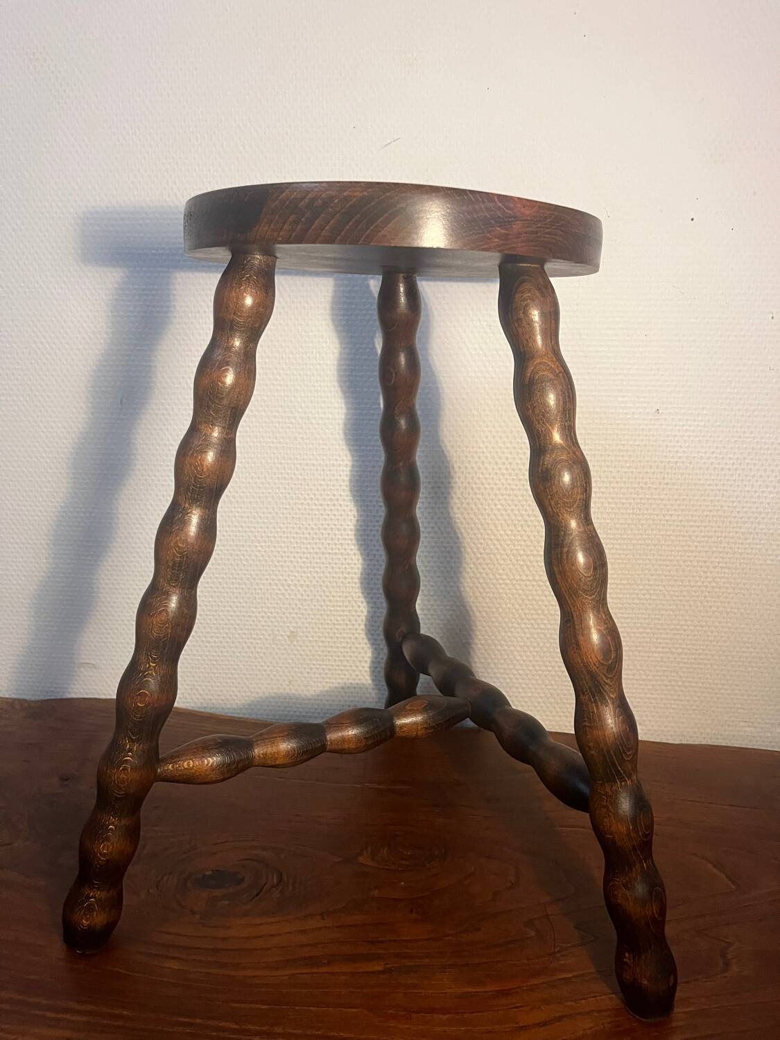 Round tripod stool with turned wooden legs