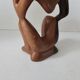 Wooden statuette sculpture of a thinking man design