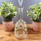 Glass carafe with enamel floral decoration and stopper – vintage