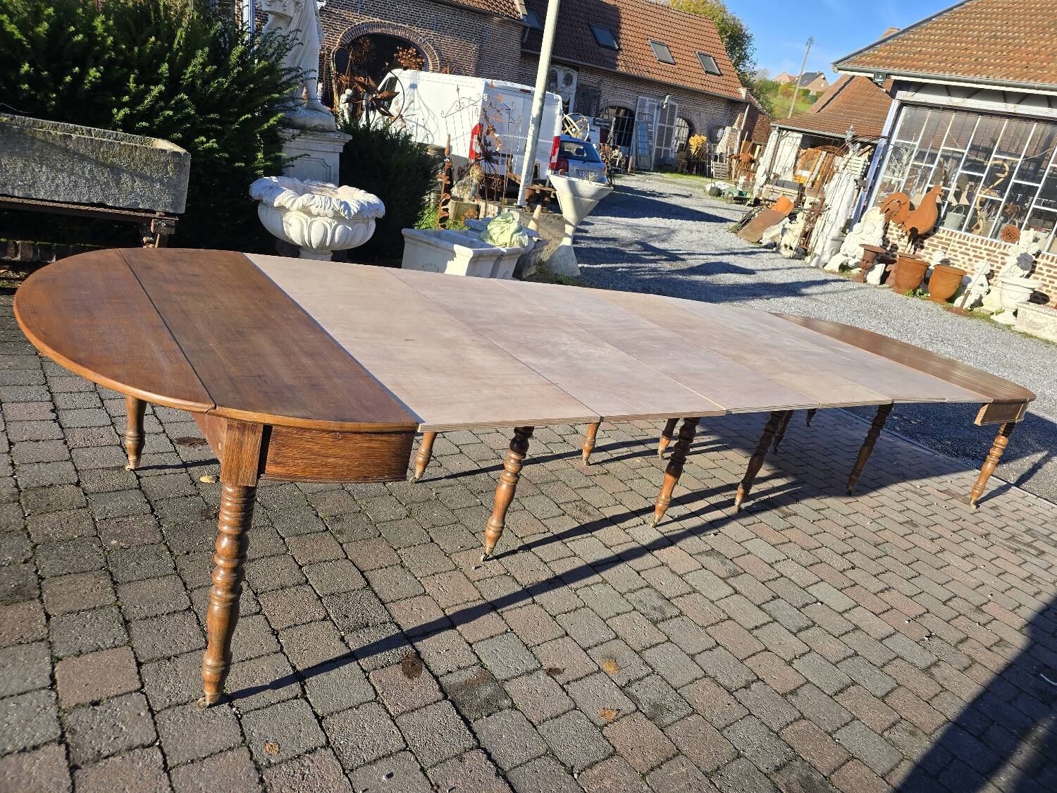 12-foot round oak table with 7 extensions / 20 people