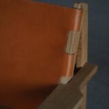 Pair of oak and leather hunting chairs by Kurt Østervig, modern Danish style from the 1960s.