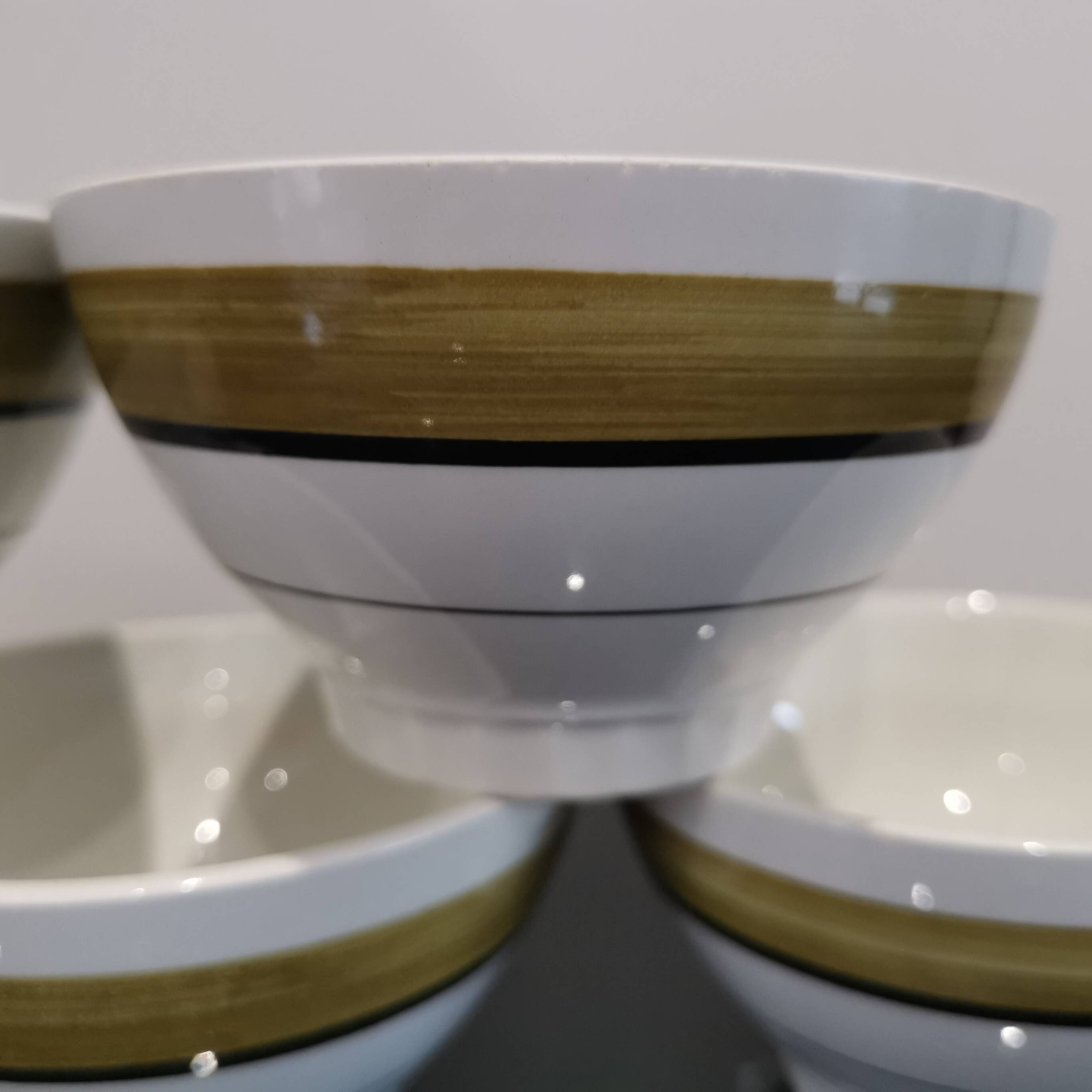 Series of 5 small old earthenware bowls with olive green edging