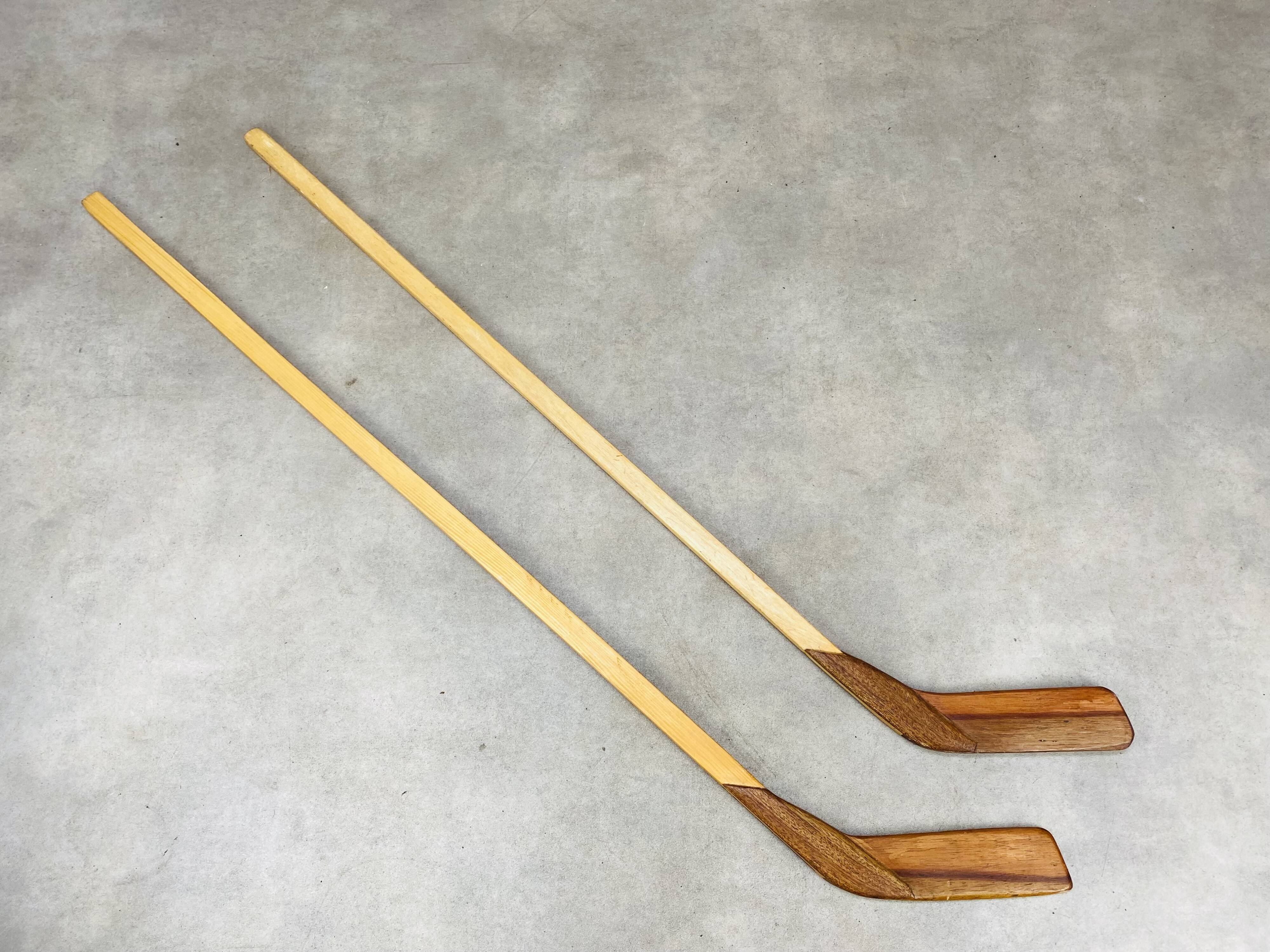 Pair of vintage wood hockey sticks