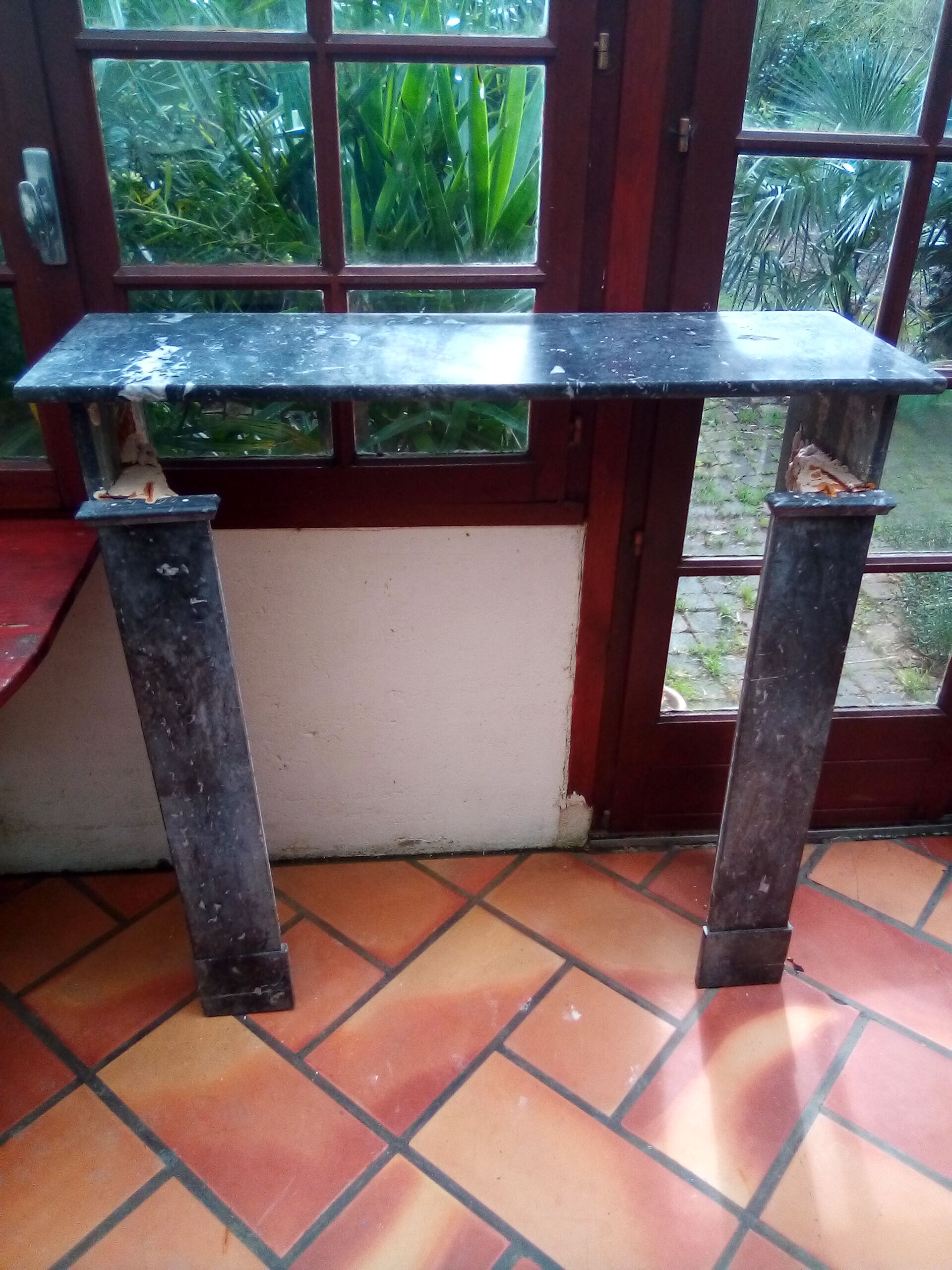 White veined black marble fireplace