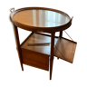 Table à thé en bois avec plateau en verre et quatre panneaux repliables