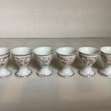 Six hand-decorated and signed egg cups