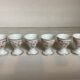 Six hand-decorated and signed egg cups