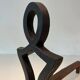 Pair of Cast Iron Chenets with Figurative Anthropomorphic Silhouette, by Raymon
