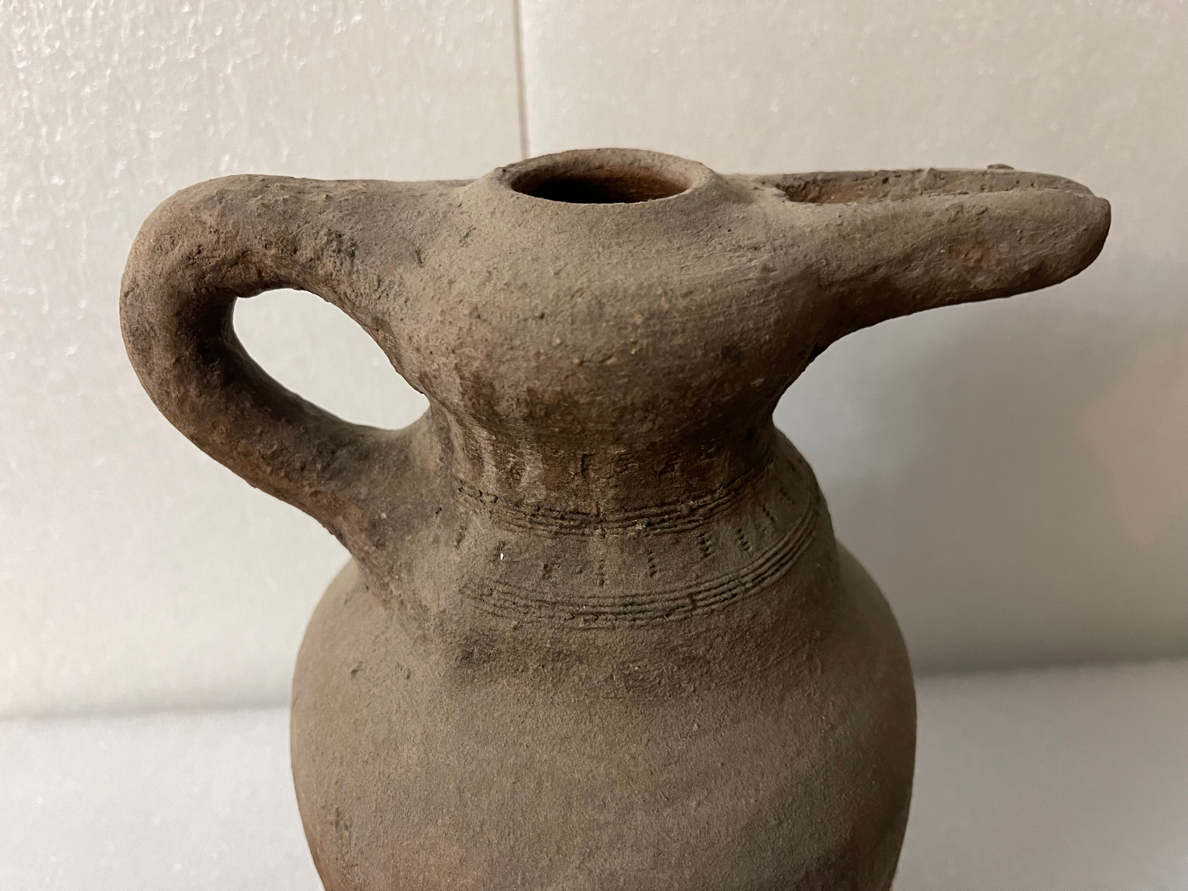 Zoomorphic pitcher with a beaked ancient Islamic ceramic birds