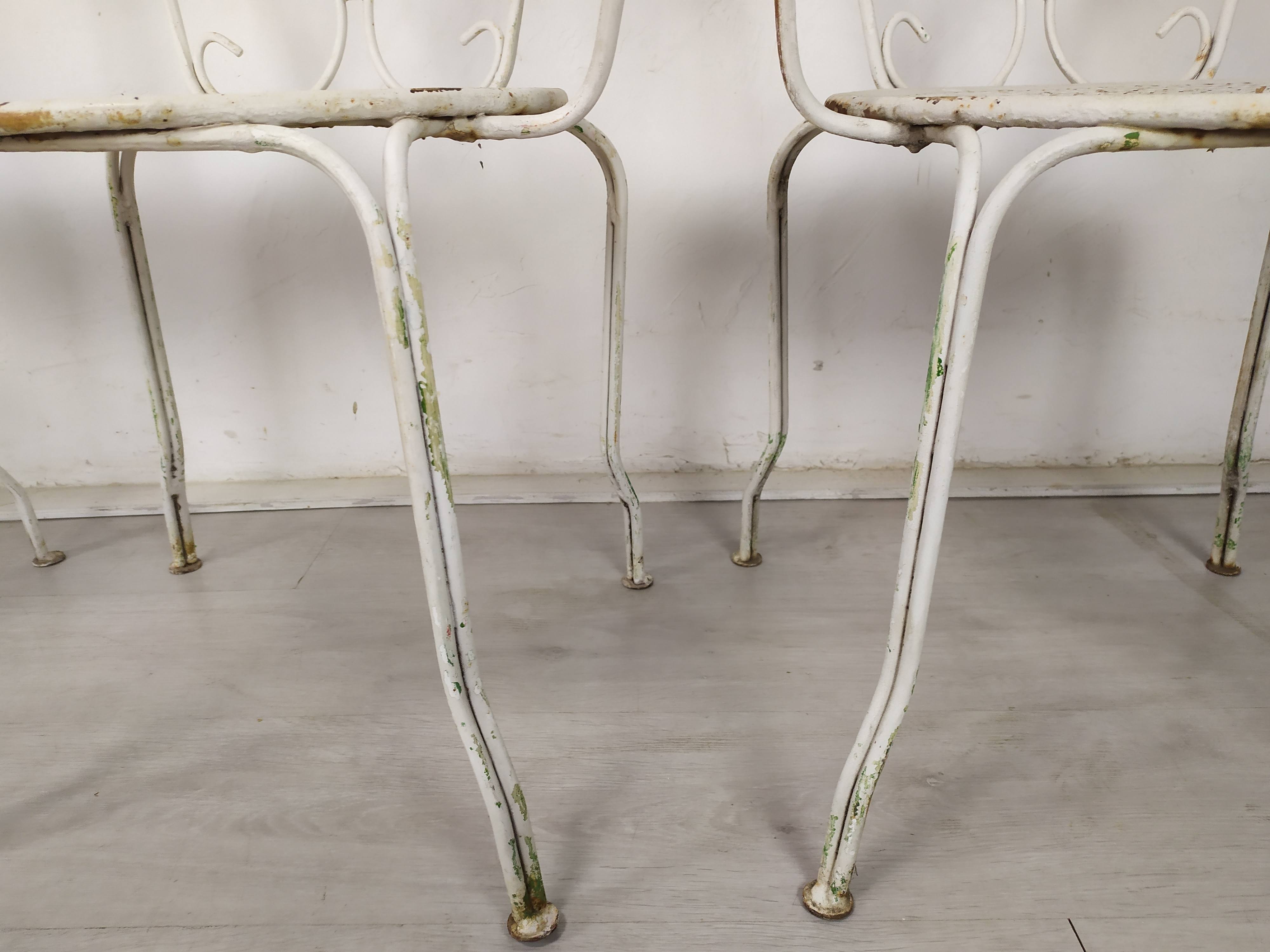 4 wrought iron garden armchairs